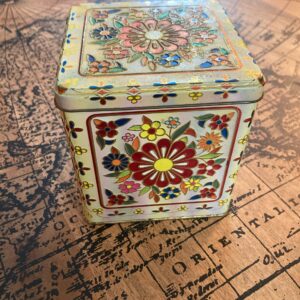 small floral tin container