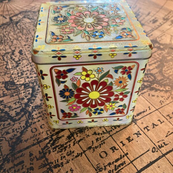 small floral tin container